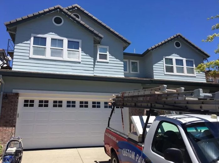 Custom painting professionals painting the exterior of a Sunol, CA area home