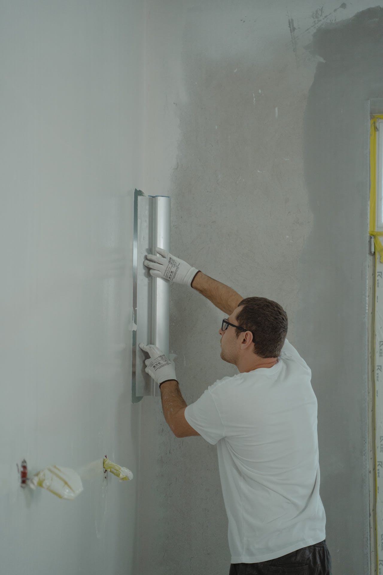 Working on cleaning the wall prior to painting for a commercial projects in Newark, CA