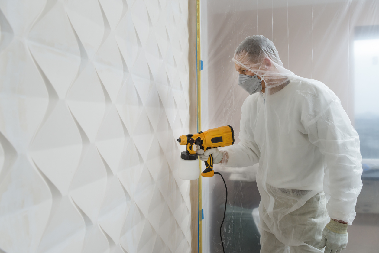 Expert painter painting a commercial business wall in Milpitas