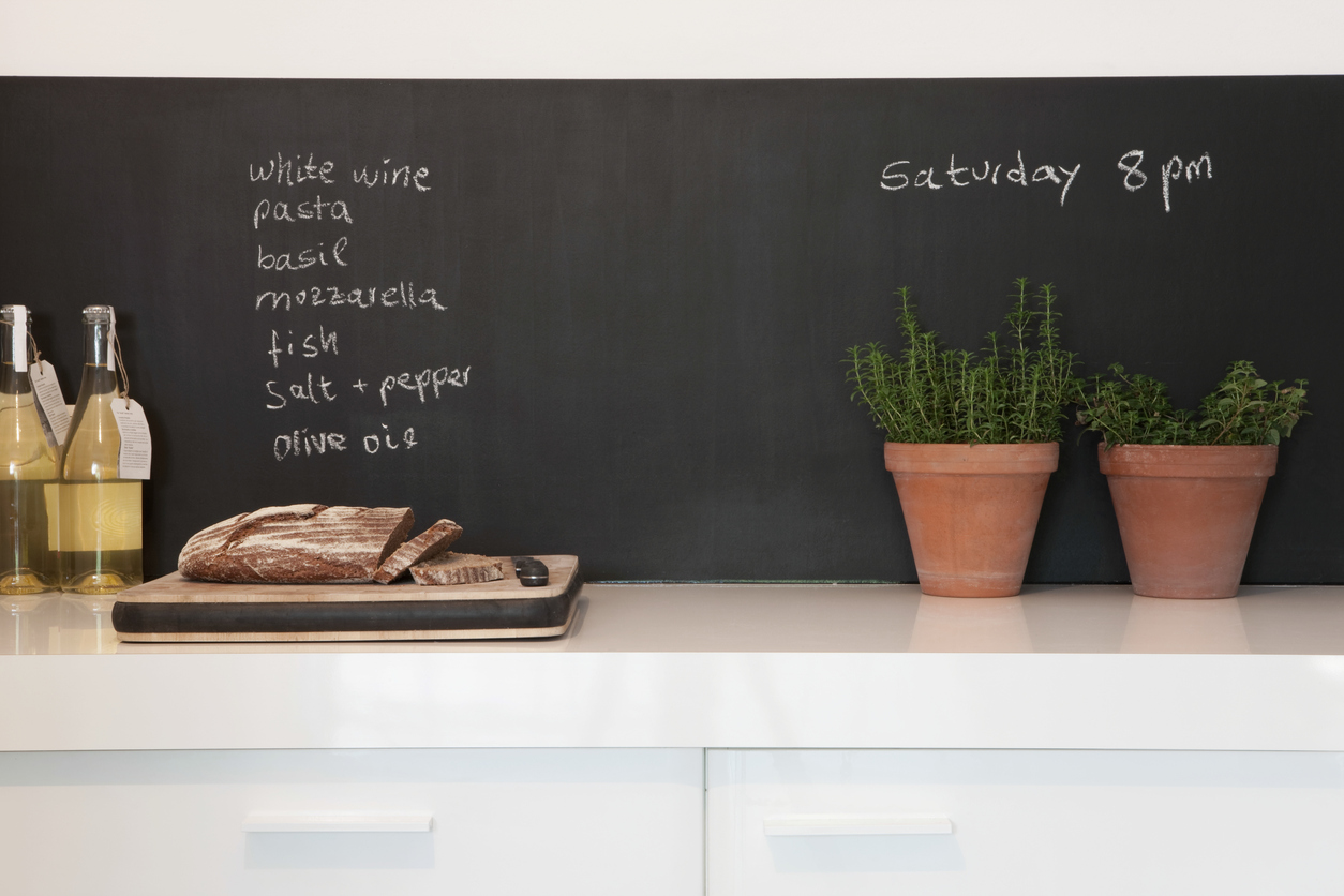 Bread On Chopping Board With Shopping List Chalkboard in a Sunnyvale kitchen