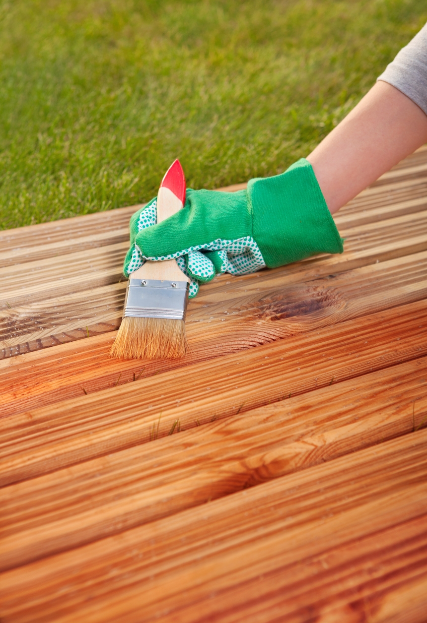 Applying protective varnish on a patio wood deck in Union City, CA